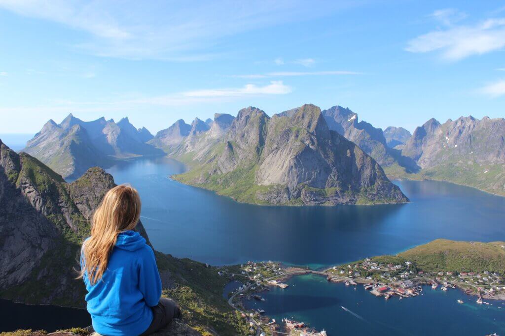 woman looking over the sea and mountains. women in travel.
Photo by Jérémie Crémer on unsplash.